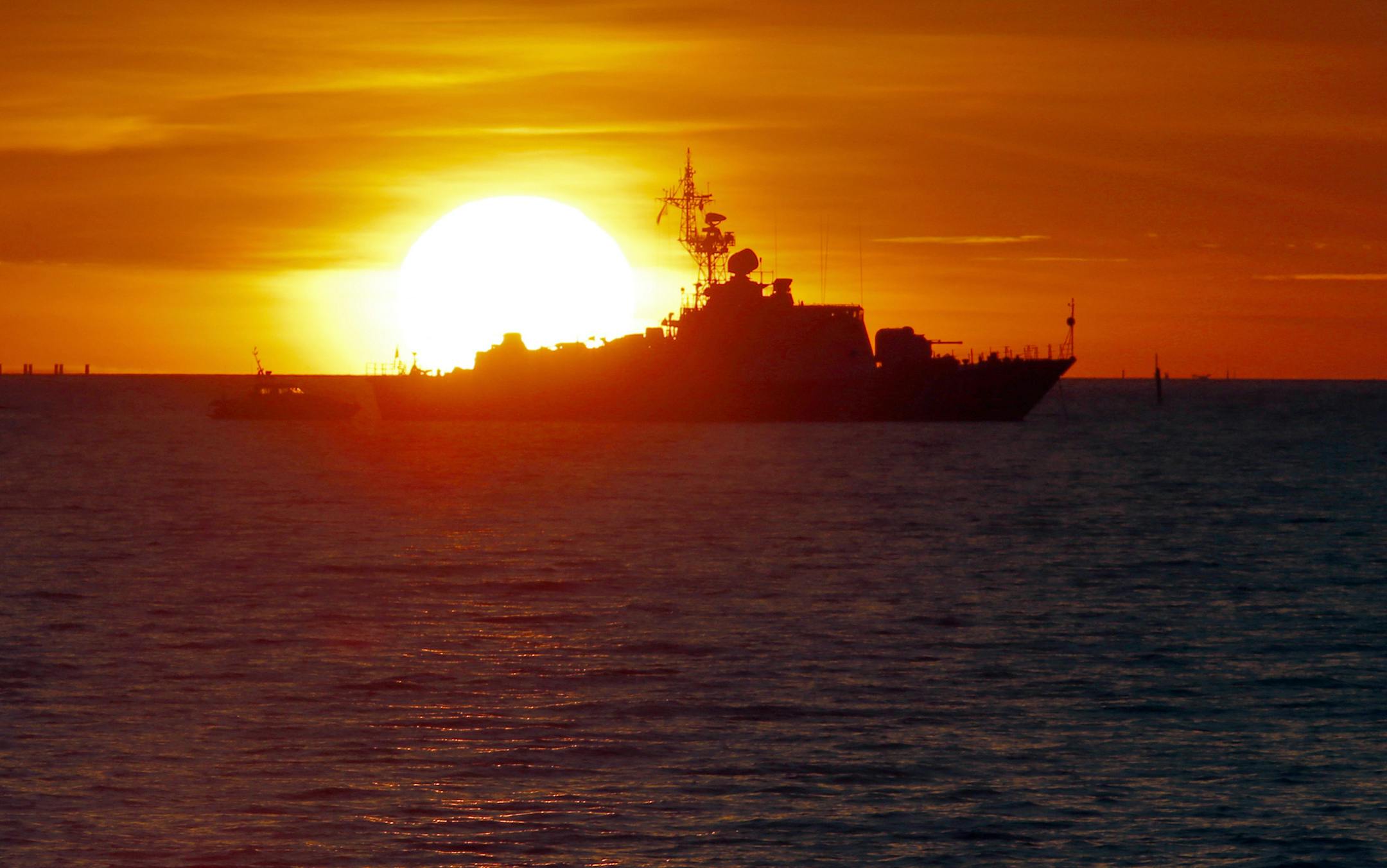 A Russian Coast Guard ship patrols the Gulf of Finland waters outside a G-20 summit at a sunset in St. Petersburg, Russia on Wednesday, Sept. 4, 2013. U.S. President Barack Obama will seek to bolster international support for a strike against Syria during talks with world leaders this week at the Group of 20 summit. Those efforts will pit him against Russian president and summit host Vladimir Putin, who has perhaps done the most to stymie international efforts to oust Syria's Bashar Assad. The G