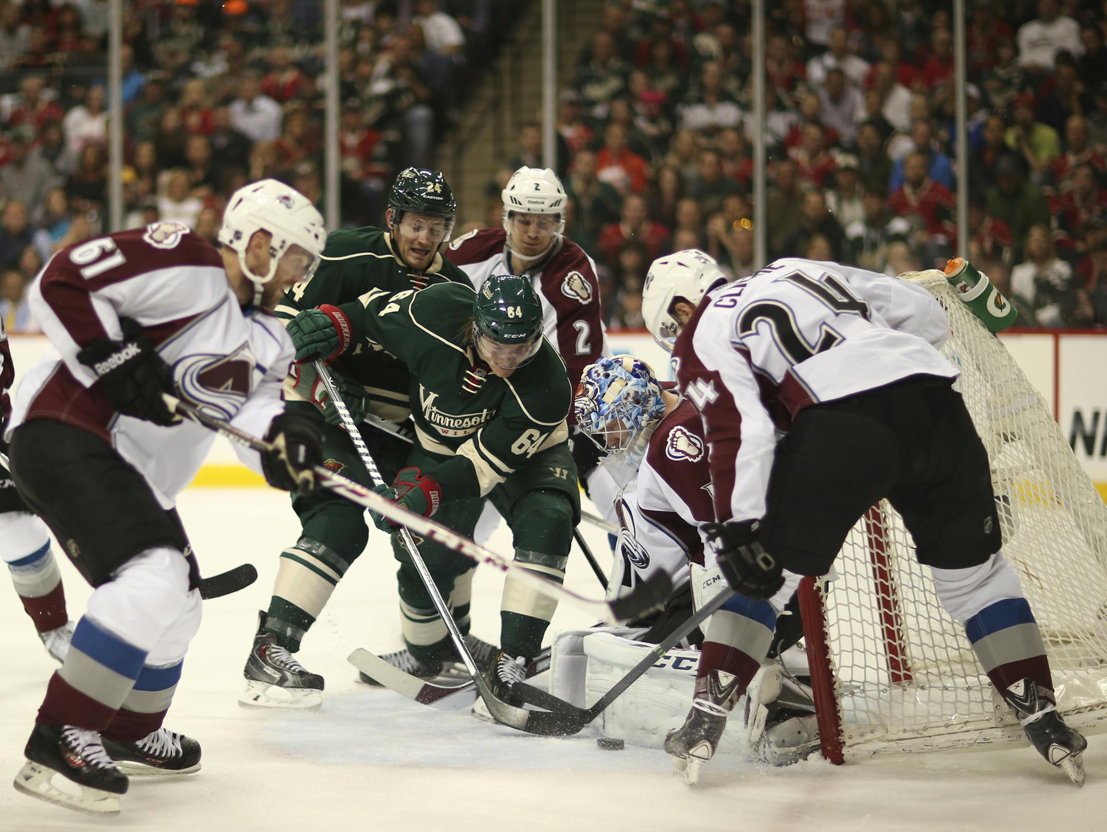Minnesota Wild center Mikael Granlund (64) kept hammering away at the puck in front of Colorado Avalanche goalie Semyon Varlamov (1) in the first period. ] JEFF WHEELER ‚Ä¢ jeff.wheeler@startribune.com The Minnesota Wild faced the Colorado Avalanche in Game 3 of their NHL playoff series Monday night, April 21, 2014 at Xcel Energy Center in St. Paul.