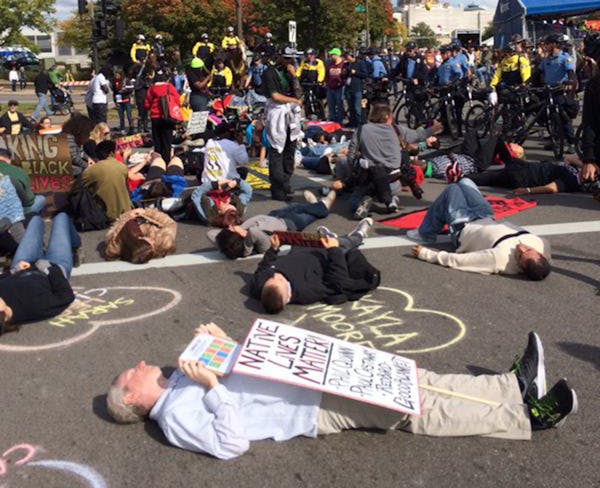 A die-in was part of the Black Lives Matter St. Paul protest at the 2015 Twin CIties Marathon.