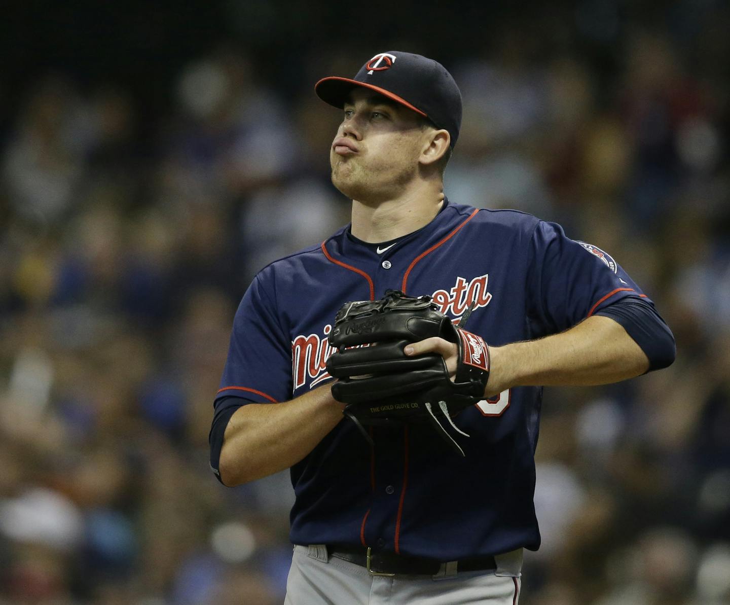 Minnesota Twins starting pitcher Trevor May reacts during the first inning of a baseball game against the Milwaukee Brewers, Friday, June 26, 2015, in Milwaukee. (AP Photo/Jeffrey Phelps)