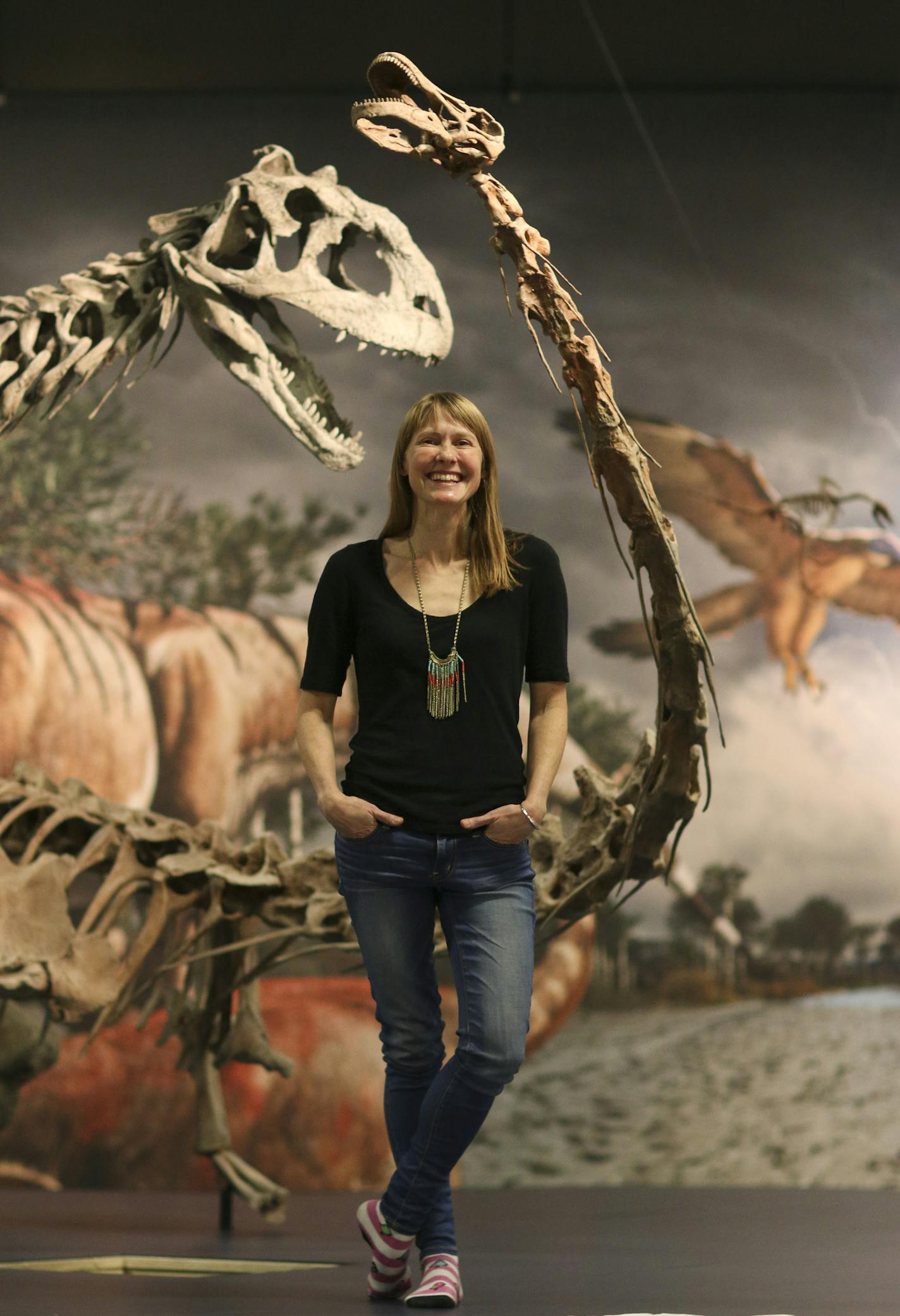 Vertebrate paleontologist and Macalester College Assistant Professor in geology and biology Kristi Curry Rogers found and subsequently got to name a titanosaur, the Rapetosaurus, while working in Madagascar in 2001. A facsimile of her discovery was assembled this week, along with many others, at the Science Museum of Minnesota for the exhibit Ultimate Dinosaurs, opening March 1st. Kristi Curry Rogers Monday afternoon, February 18, 2014, with her long-necked discovery, the Rapetosaurus, at the Sc