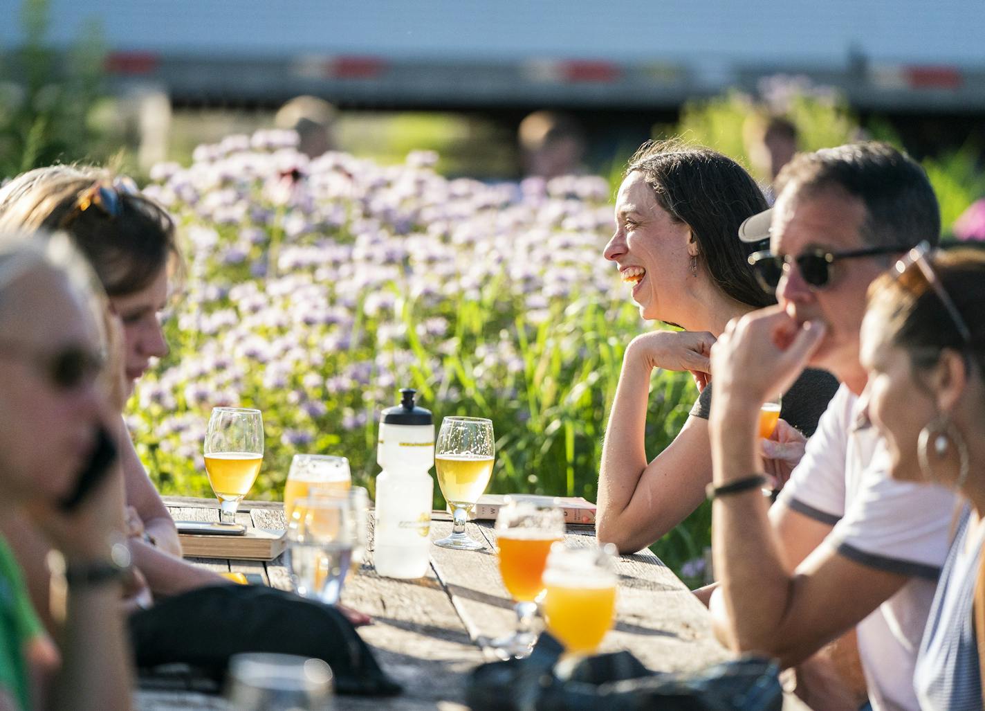 Mariah Straub enjoys time with friends on the patio at Bang Brewing. ] LEILA NAVIDI &#x2022; leila.navidi@startribune.com BACKGROUND INFORMATION: Bang Brewing in St. Paul on Thursday, July 11, 2019.