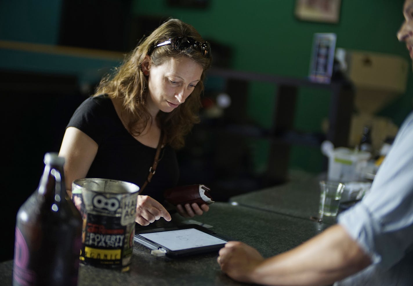 At Harriet Brewing, Maud Meijers purchased a growler of Wodan Weizen. Purchasing a growler on Sunday is now legal in Minnesota. ] Richard Tsong-Taatarii/rtsong-taatarii@startribune.com