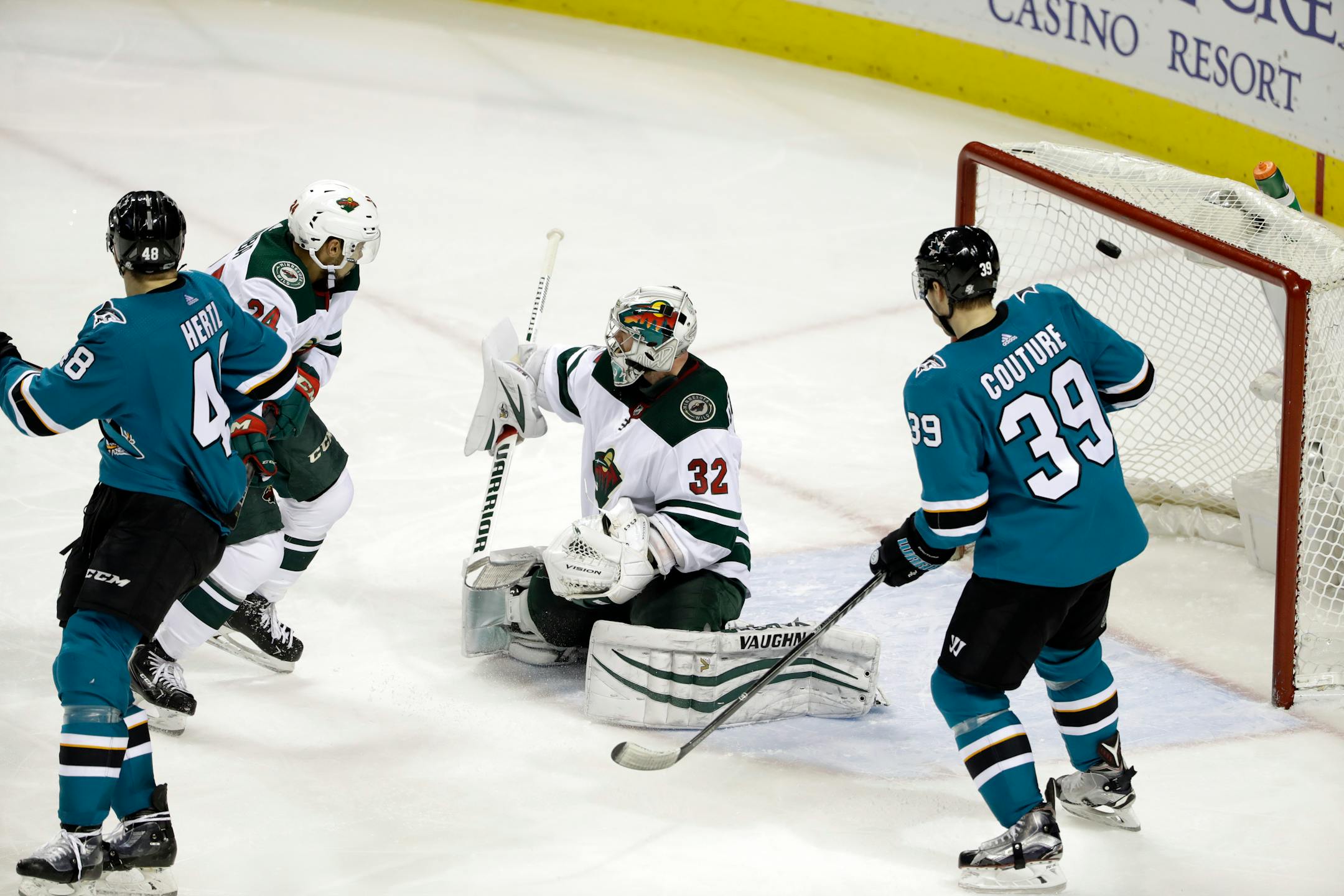 Minnesota Wild goalie Alex Stalock (32) is beaten for a goal on a shot from San Jose Sharks' Brent Burns during the third period of an NHL hockey game Sunday, Dec. 10, 2017, in San Jose, Calif. (AP Photo/Marcio Jose Sanchez)