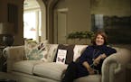 Homebuilder representative Kris Griswold Holmberg, in a Plymouth model home, spends a lot of time alone. She said she has no problem discussing her ow