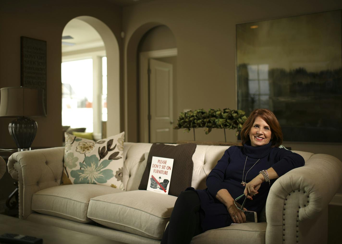 Homebuilder representative Kris Griswold Holmberg, in a Plymouth model home, spends a lot of time alone. She said she has no problem discussing her own feelings, but she has lonely friends who won&#x2019;t talk about theirs. Fighting loneliness is &#x201c;a mind-over-matter kind of thing.&#x201d;