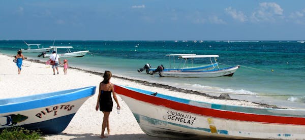 Boats dot the beach in Puerto Morelos, a sleepy town in Mexico&#x2019;s Yucat&#xe1;n.