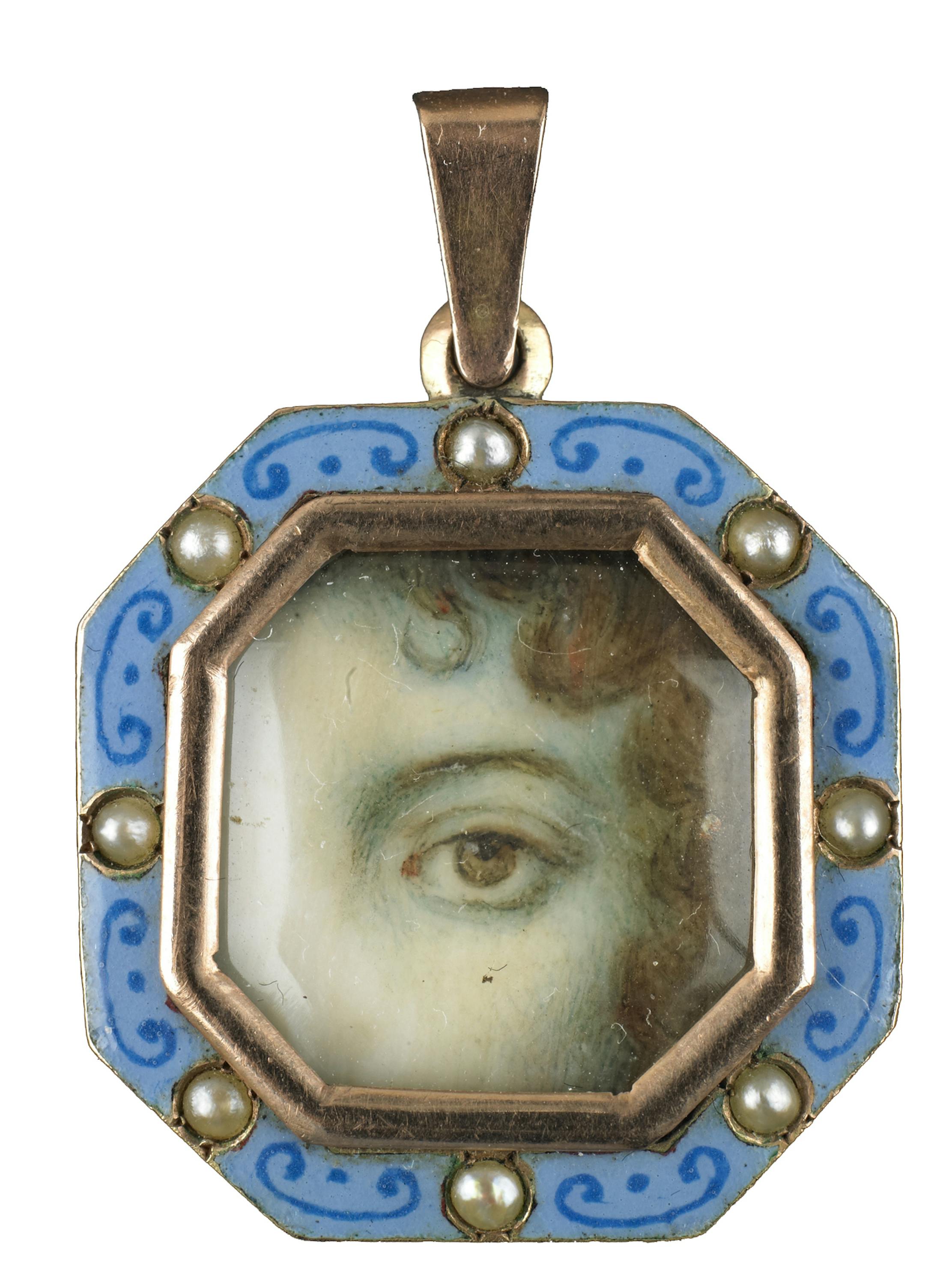 Minneapolis Institute of Arts The Look of Love: Eye Miniatures from the Skier Collection Rose gold octagonal pendant surrounded by blue enamel with half pearls Brown left eye. Dimensions: 1 √ó 11/16 √ó 1/8 in.