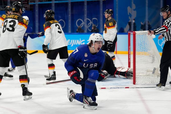 Gophers forward Matt Knies celebrated his second-period goal for the U.S. in a 3-2 win over Germany at the Beijing Olympics.