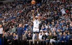 Nickeil Alexander-Walker (9) of the Minnesota Timberwolves makes a three pointer in the third quarter Wednesday, March 27, 2024, at Target Center in M