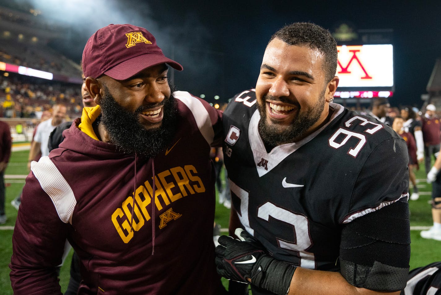 Minnesota defensive lineman Kyler Baugh (93) celebrates with a coach after sacking Eastern Michigan quarterback Austin Smith (4) to end the game Saturday, Sep. 09, 2023, at Huntington Bank Stadium in Minneapolis, Minn. ]