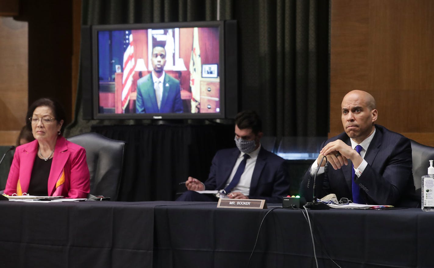 Sen. Mazie Hirono, D-Hawaii, and Sen. Cory Booker, D-N.J., listened to video testimony from St. Paul Mayor Melvin Carter during a Senate Judiciary Committee hearing on police use of force and community relations on on Capitol Hill, Tuesday, June 16, 2020 in Washington.