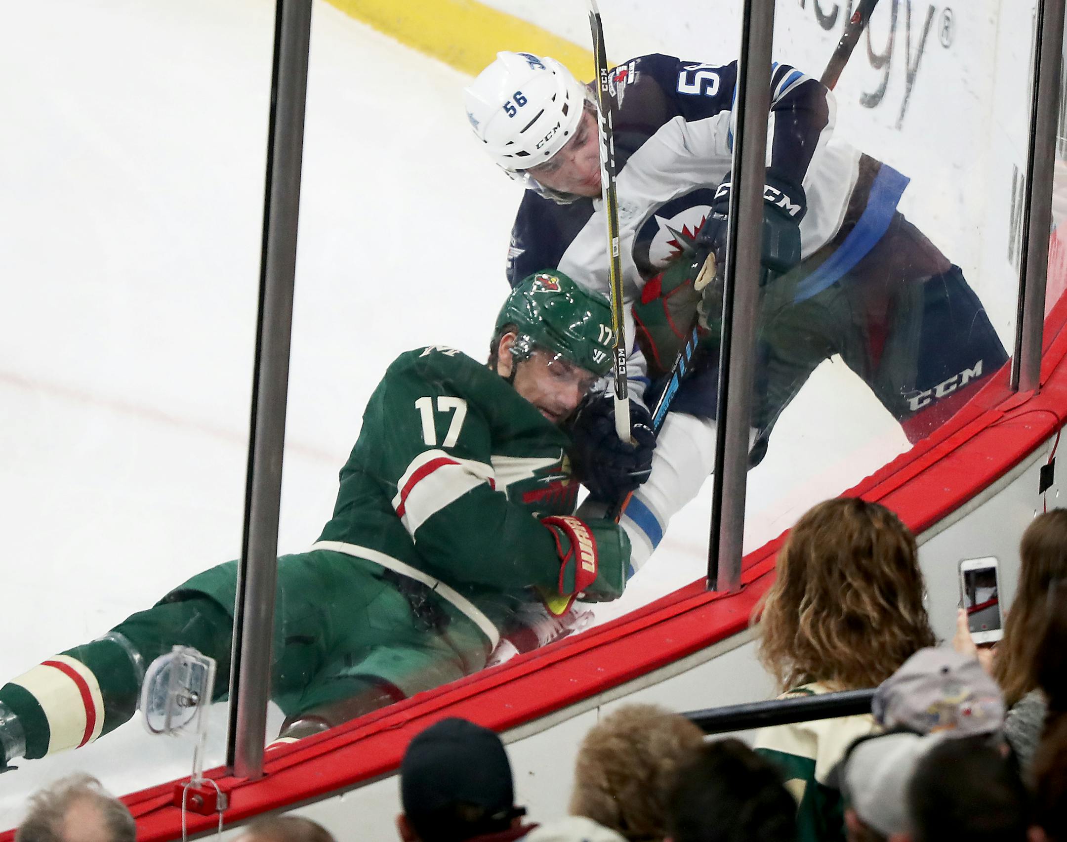 The Minnesota Wild's Marcus Foligno (17) tangles with the Winnipeg Jets Marko Dano (56) in the corner Saturday, Jan. 13, 2018, at the Xcel Energy Center in St. Paul, MN. ] DAVID JOLES ï david.joles@startribune.com Winnipeg Jets versus the Minnesota Wild