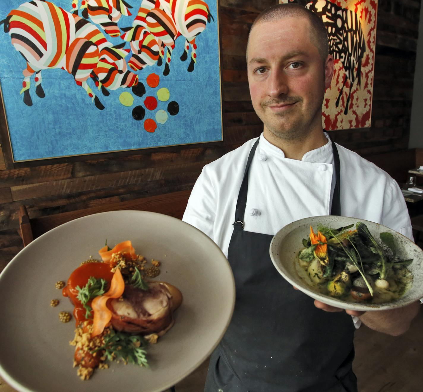 Chef Jim Christiansen with rabbit dish, left, and veggie dish. ] Review of Heyday Restaurant and Bar. (MARLIN LEVISON/STARTRIBUNE(mlevison@startribune.com) ORG XMIT: MIN1407162305181663