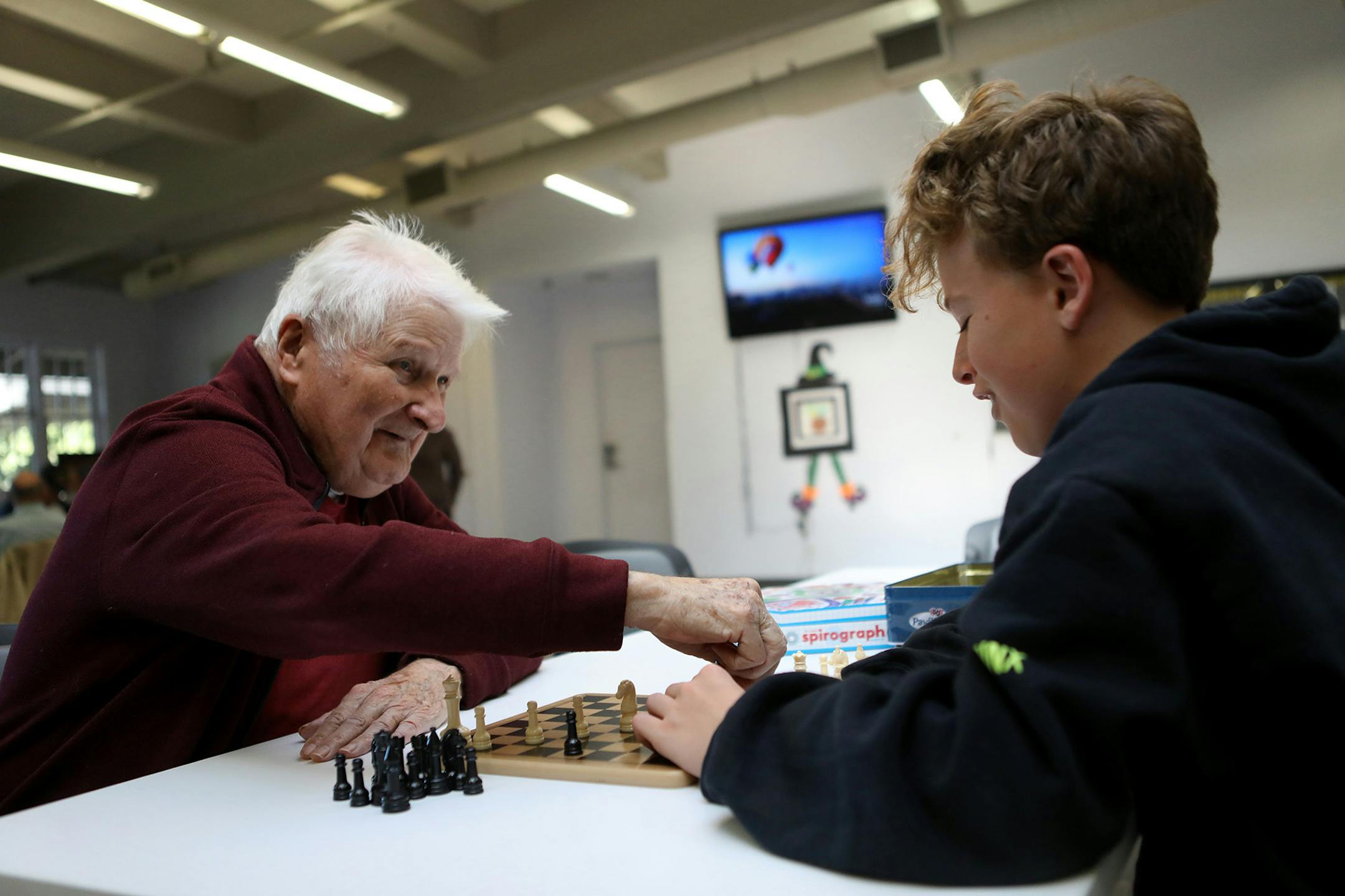 Rudi Dorn, left, wins a chess match against Gavin Bovone, 15, right, a sophomore from Bellarmine High School at Hearts & Minds Activity Center in San Jose, Calif., on Thursday, Oct. 24, 2019. (Anda Chu/Bay Area News Group/TNS) ORG XMIT: 1513654