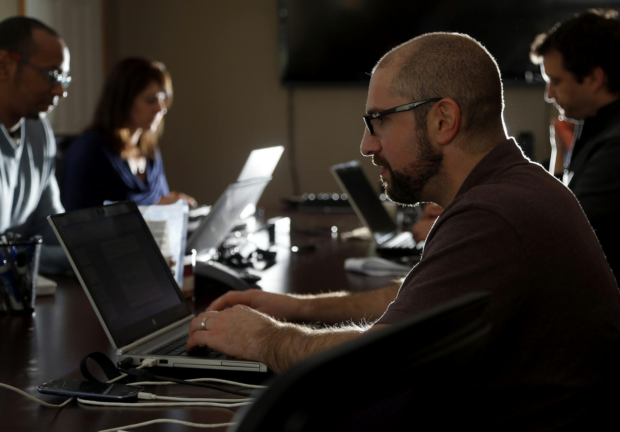 Brian Rosenberg worked on a project with coworkers at Logic Information Systems in Inver Grove Heights on Wednesday. ] CARLOS GONZALEZ cgonzalez@startribune.com April 24, 2013, Inver Grove Heights, MN, Logic Information Systems, Businesses control massive and growing streams of information that flow from cash registers, patient records, smartphones, warehouses, the sensors in your Nikes, databases, Facebook, and good old-fashioned loyalty cards. They want to put it all together and make better s