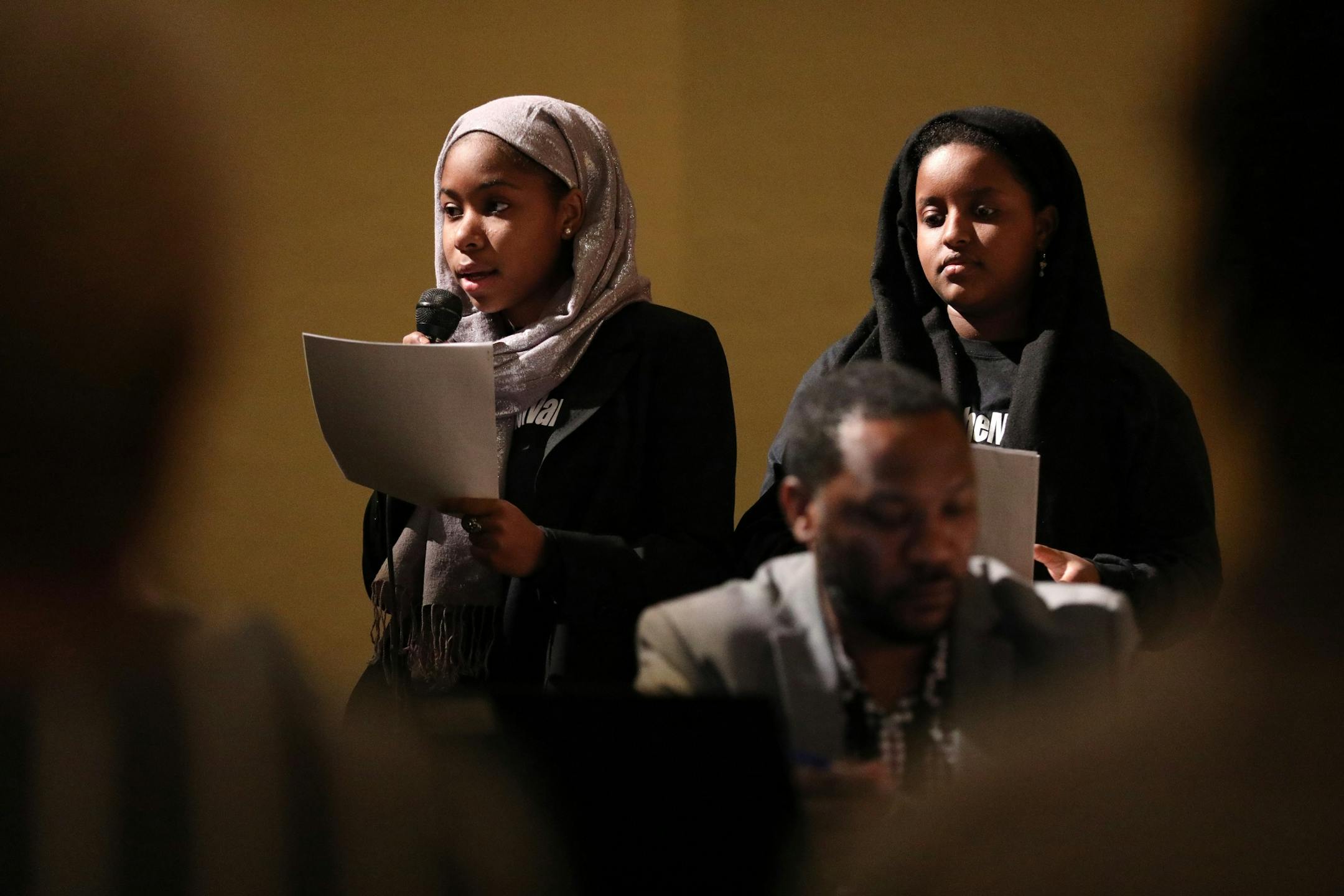 Patrick Henry High School freshman Janaan Ahmed, left, and senior Farhiyo Hassan presented in favor of changing the high school's name during the site council meeting Thursday.
