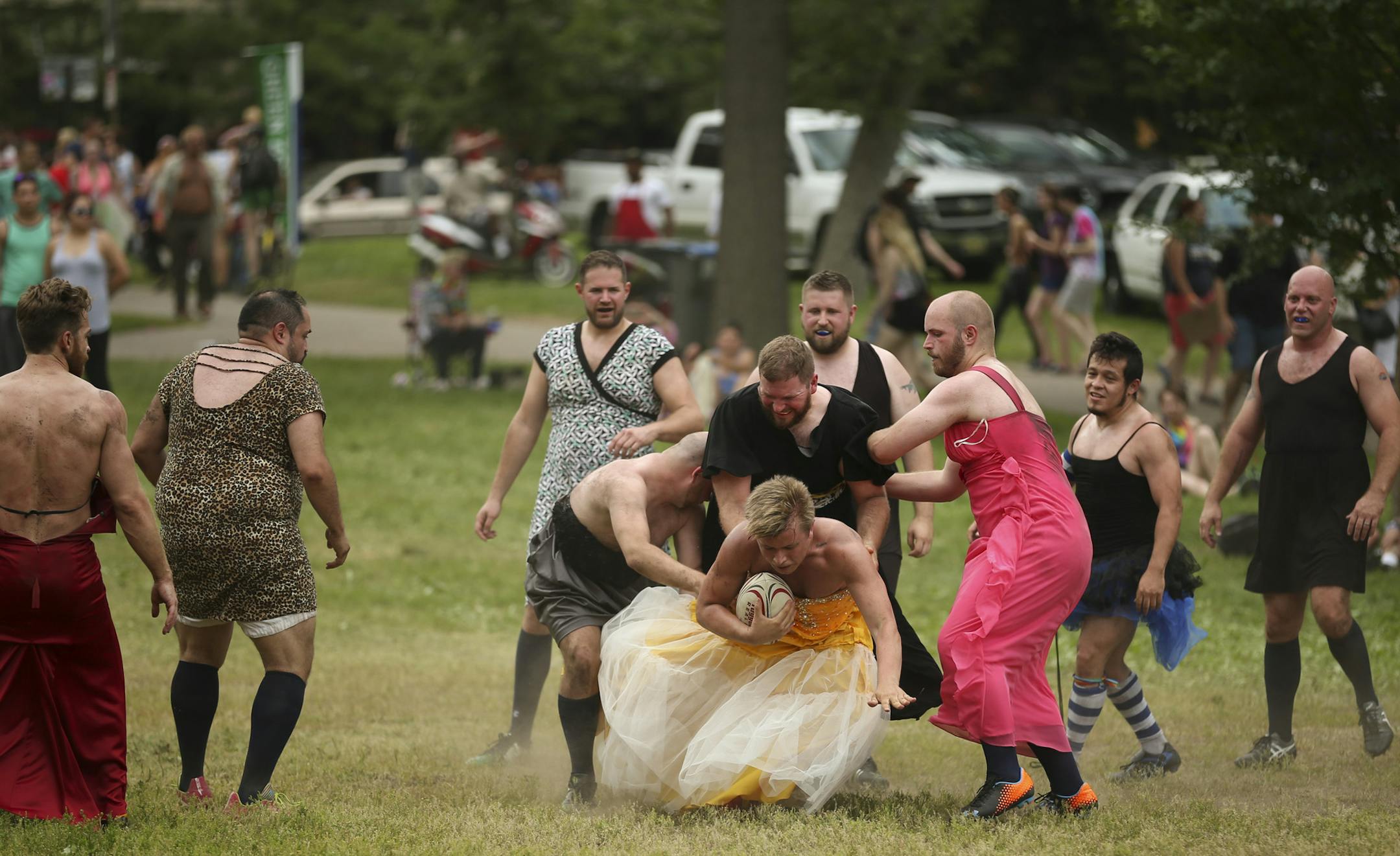 Members of Minneapolis Mayhem Rugby Football Club played a scrimmage - in formal wear - in Loring Park Sunday afternoon. ] JEFF WHEELER • jeff.wheeler@startribune.com The 2015 Ashley Rukes GLBT Pride Parade was held along Hennepin Ave. Sunday, June 28, 2015 in Minneapolis.