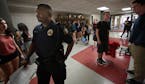 Cortez Hull, school resource officer (SRO) at Highland Park High School in St. Paul, monitored the hallways as classes let out for the day.