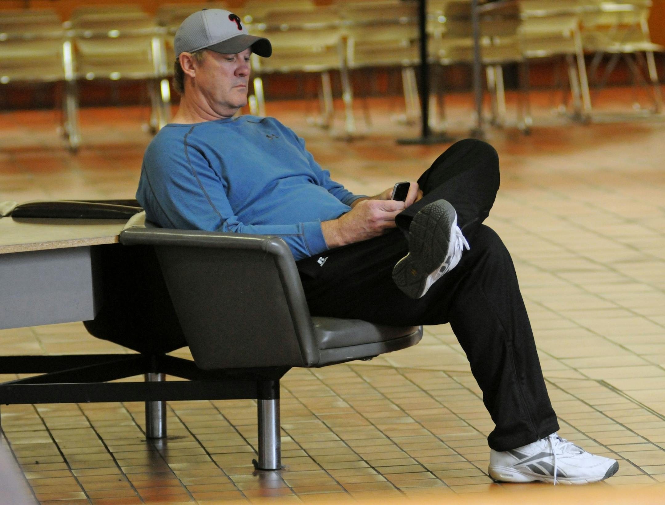 Joe Senser sat in the lobby of the Hennepin County Government Center on Friday morning. At one point he vented his frustration at photographers who were taking pictures and video of him.