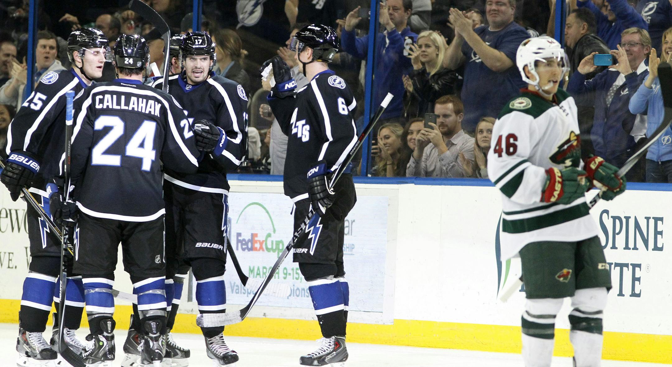The Tampa Bay Lightning celebrate the go-ahead goal scored by center Alex Killorn (17), center, as Minnesota Wild defenseman Jared Spurgeon (46) skates off during second period action Saturday, Nov. 22, 2014 at the Amalie Arena in Tampa, Fla. (Dirk Shadd/Tampa Bay Times/TNS)