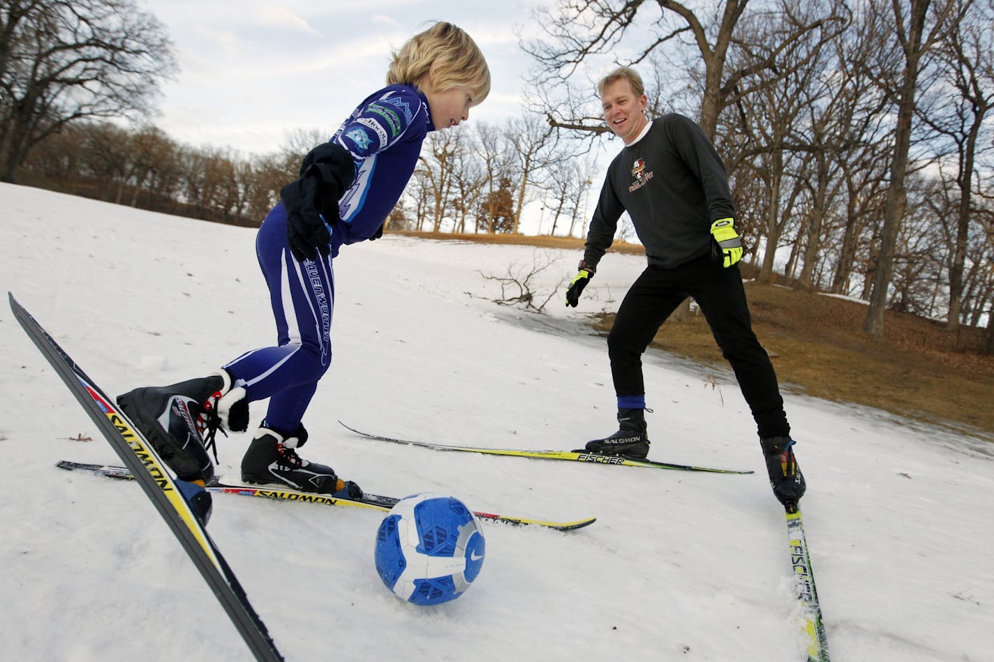 Finn Edevold, 6, and his dad, Eric, got the best of two seasons Monday, playing a little soccer aboard their cross-country skis at Theodore Wirth Park.