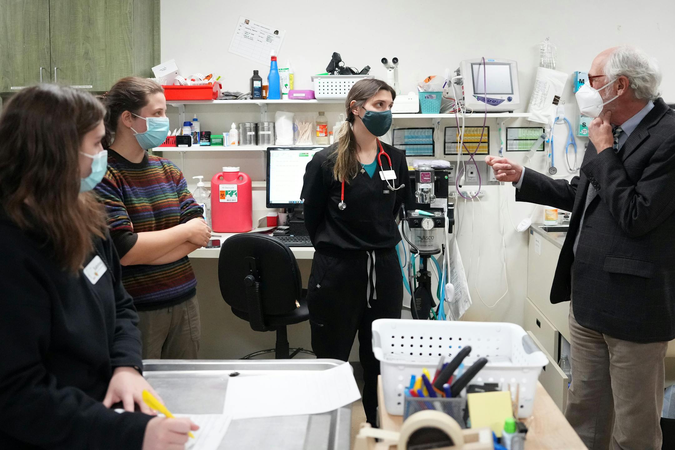Executive director Phil Jenni talked with staff members at the Wildlife Rehabilitation Center in Roseville.