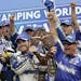 Brian Vickers celebrates with a giant lobster and his crew in victory lane after winning the NASCAR Sprint Cup Series race, Sunday, at New Hampshire M