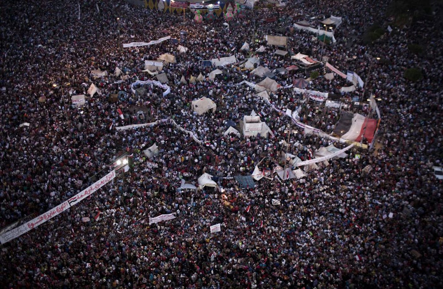 Supporters of Egypt's top military officer, Gen. Abdel-Fatah el-Sissi rally in Tahrir Square in Cairo, Egypt, Friday, July 26, 2013. Prosecutors opened an investigation of ousted President Mohammed Morsi on charges including murder and conspiracy with the Palestinian militant group Hamas, fueling tensions amid a showdown in the streets between tens of thousands of backers of the military and supporters calling for the Islamist leader's reinstatement.