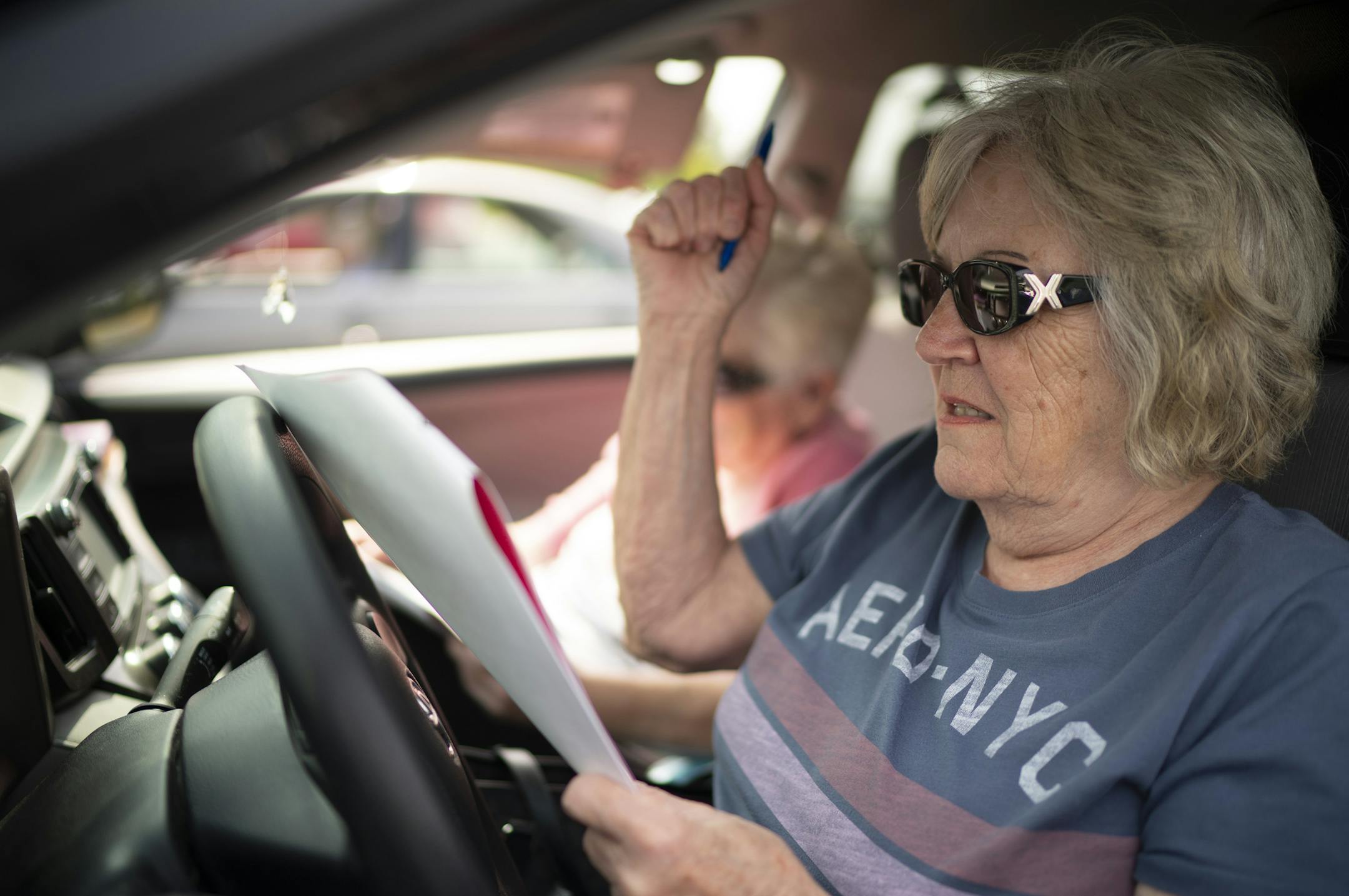 Patty Clapp celebrated when a number she had on her card was called. She was playing along with Betty Lees, and Shirley Sorenson, not seen in the back seat. ] JEFF WHEELER • jeff.wheeler@startribune.com Coon Rapids seniors looking to get out of their houses for some fun have been heading to the Coon Rapids Soccer Complex parking lot to play bingo – in their cars. This week's game drew about 30 cars on Monday afternoon, September 21, 2020.