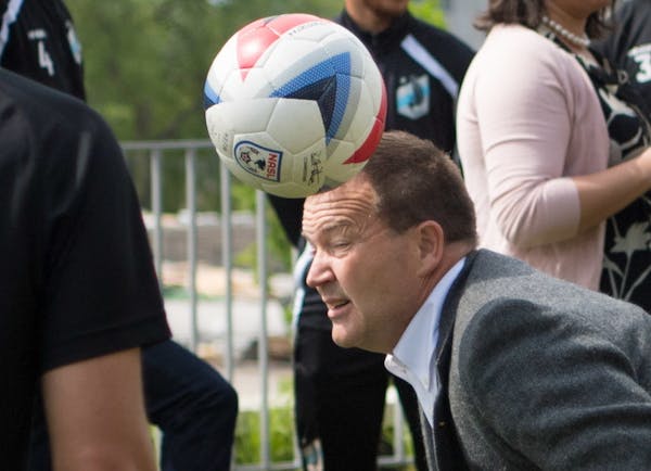 Rep. Leon Lillie kicked a soccer ball around during the event.