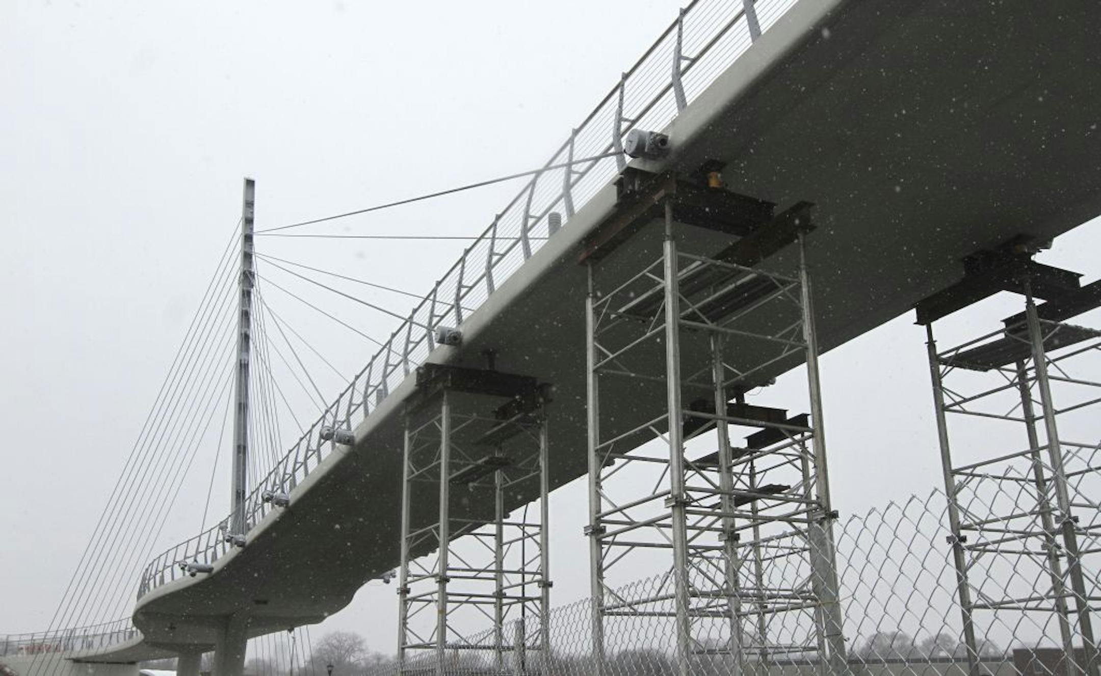 Scaffolding was put underneath the Martin Olav Sabo Bridge in Minneapolis after a support cable broke loose.