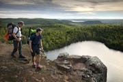 Day-7 - One of the most stunning vistas along the Superior Hiking Trail is the overlook at Bean Lake north of Silver Bay. Here, father and son hikers,