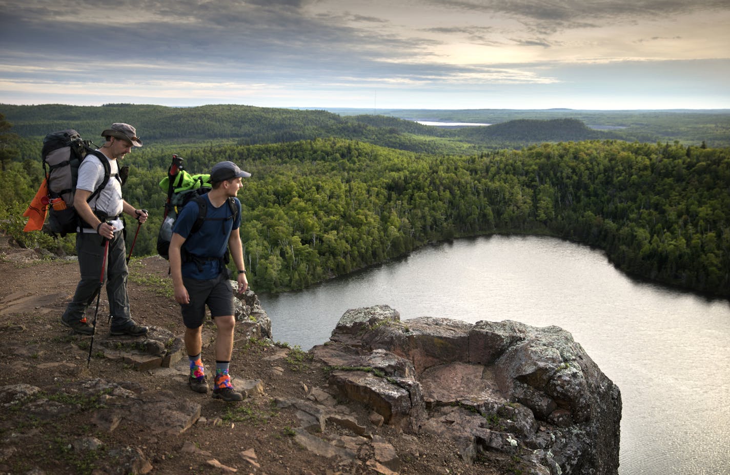 Day-7 - One of the most stunning vistas along the Superior Hiking Trail is the overlook at Bean Lake north of Silver Bay. Here, father and son hikers, Tom and Ross Perigo enjoyed the evening view high above Bean Lake. ] Superior Hiking Trail.
BRIAN PETERSON &#x2022; brian.peterson@startribune.com
Superior Hiking Trail, MN 06/08/2018