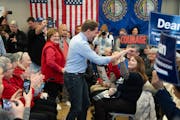 Dean Phillips high-fived a supporter as he took the stage to speak to a crowd at a GOTV event at the Nashua Senior Activity Center Saturday, Jan. 20, 