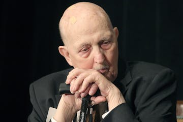 In a Thursday, May 7, 2015 photo, former St. Paul Mayor Larry Cohen, 1972-1976, listens to other mayors as they speak during the annual Saint Paul Fou