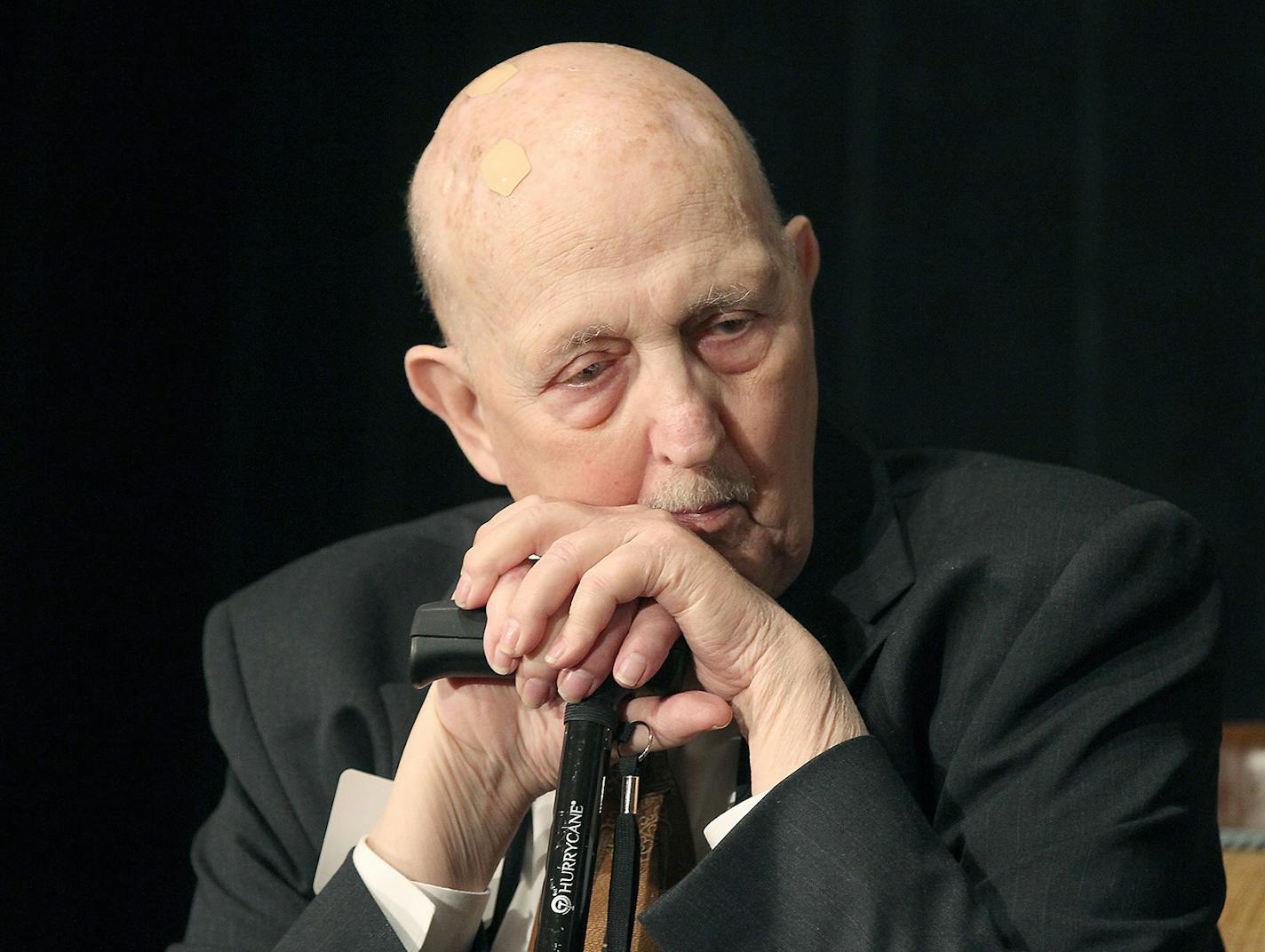 In a Thursday, May 7, 2015 photo, former St. Paul Mayor Larry Cohen, 1972-1976, listens to other mayors as they speak during the annual Saint Paul Foundation breakfast, at the St. Paul Hotel in St. Paul, Minn. Cohen died at home Sunday, Sept. 11, 2016, surrounded by his family, according to his son, Scott. He was 83. (Elizabeth Flores/Star Tribune via AP) ORG XMIT: MIN2016091211024314