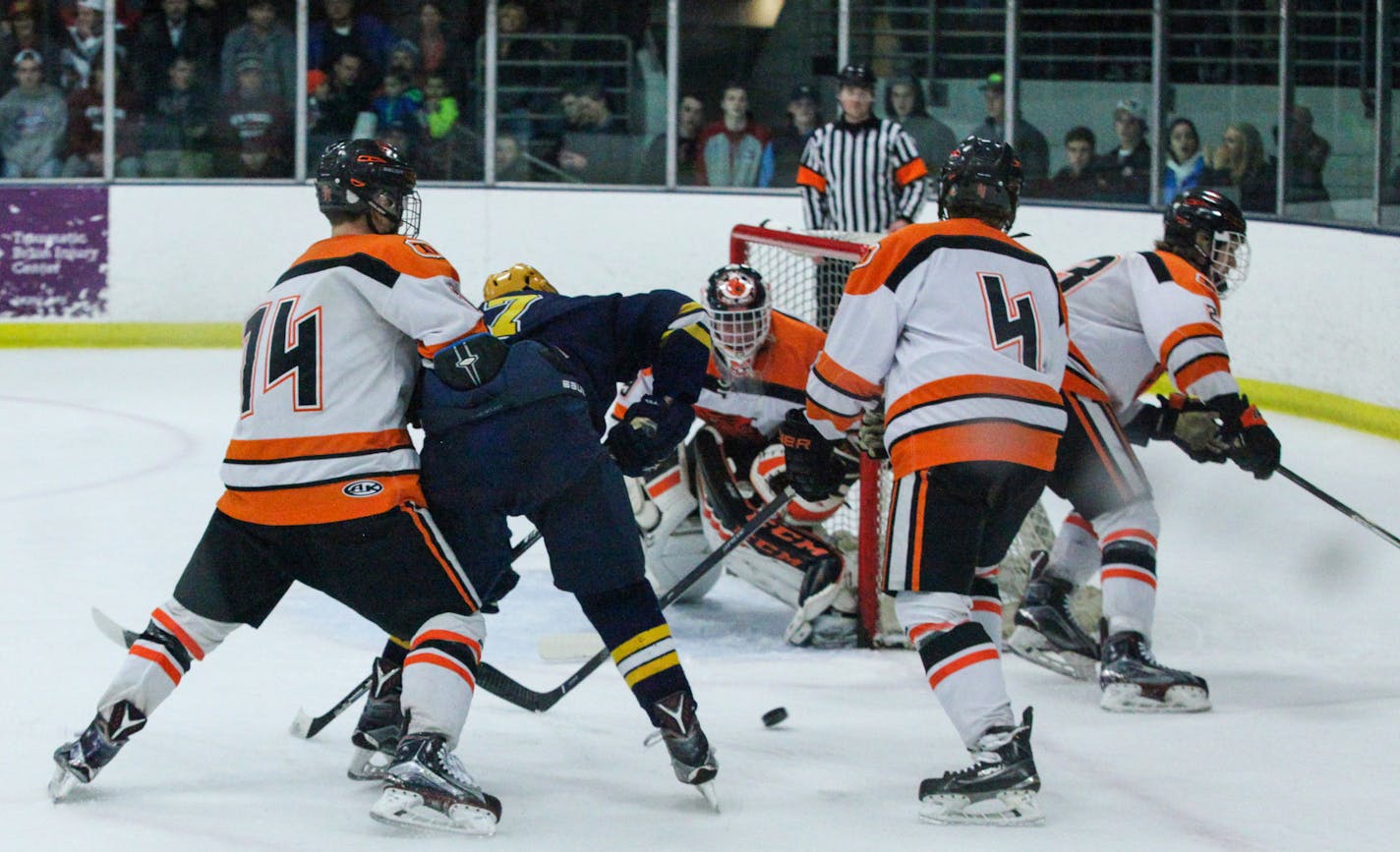 Delano High School Jackson Hjelle (29) blocks the opponents' shot in the first period. ] XAVIER WANG &#x2022; xavier.wang@startribune.com Game action from an Minnesota Boys Section 2A Tournament hockey game between the Breck School and the Delano Thursday. March, 2. 2017 at Parade Ice Garden in Minneapolis.