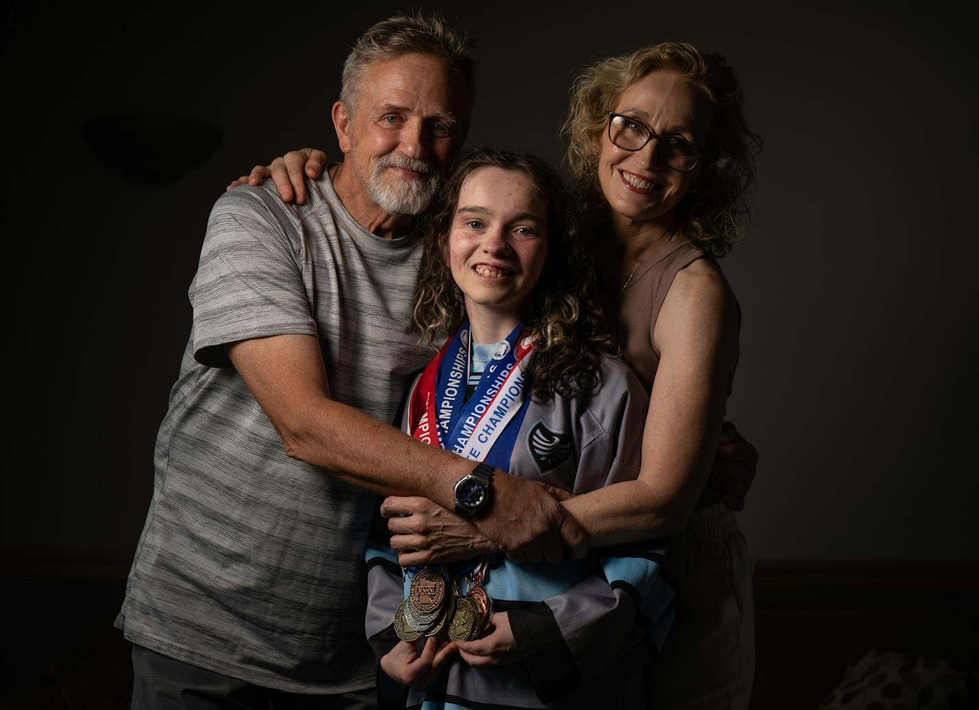 A portrait of Fiona Sitzmann, a winner of many state titles as an adapted sports athlete for the Dakota United co-op with her parents Rob and Rebecca Sitzmann Thursday June 22,2023 in Eagan,Minn.] JERRY HOLT • jerry.holt@startribune.com