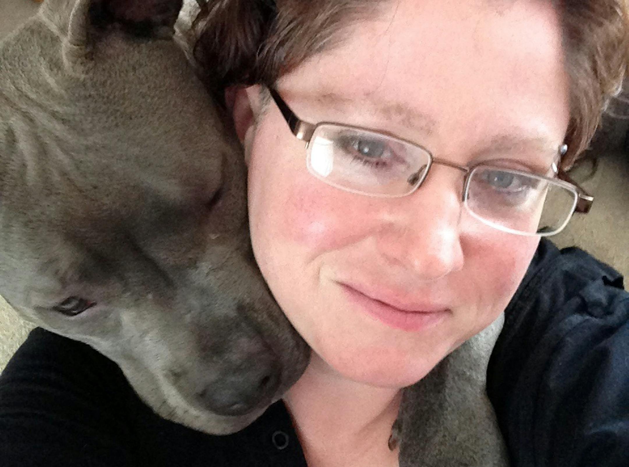 Heather Brewer, dog rescuer, with one of her dogs