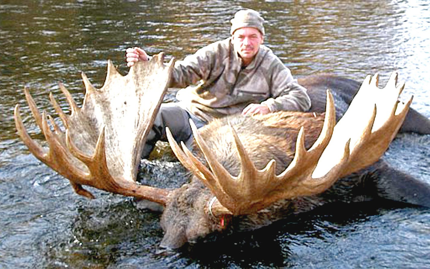 Hennepin County Sheriff's Sgt. Brad Erickson of Minnetonka with the bull moose he shot in the Alaskan interior last month. The antler spread was 74¼ inches and when officially measured might be among the top dozen or so moose killed worldwide. A late uncle's generosity allowed Erickson to make the hunting trip.