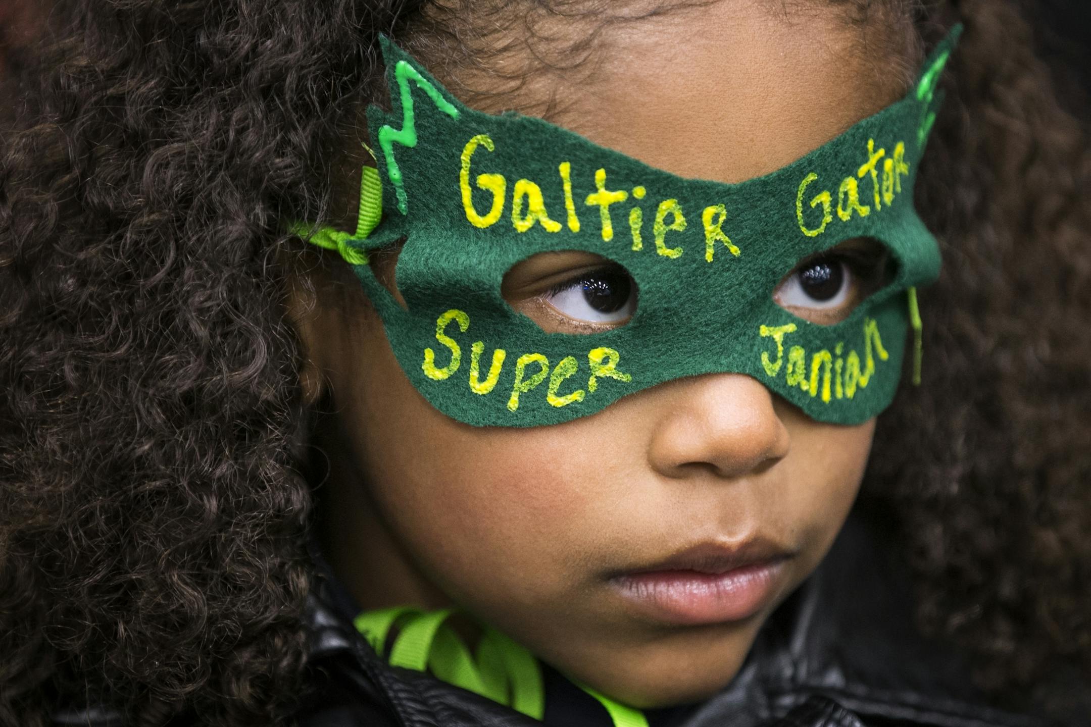 Galtier Community School kindergartener Janiah Jordan, 6, wears a mask supporting her school during the public comment portion of a St. Paul School Board meeting.