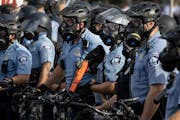 Minneapolis police officers gathered in May amid the protests over the killing of George Floyd while in police custody.