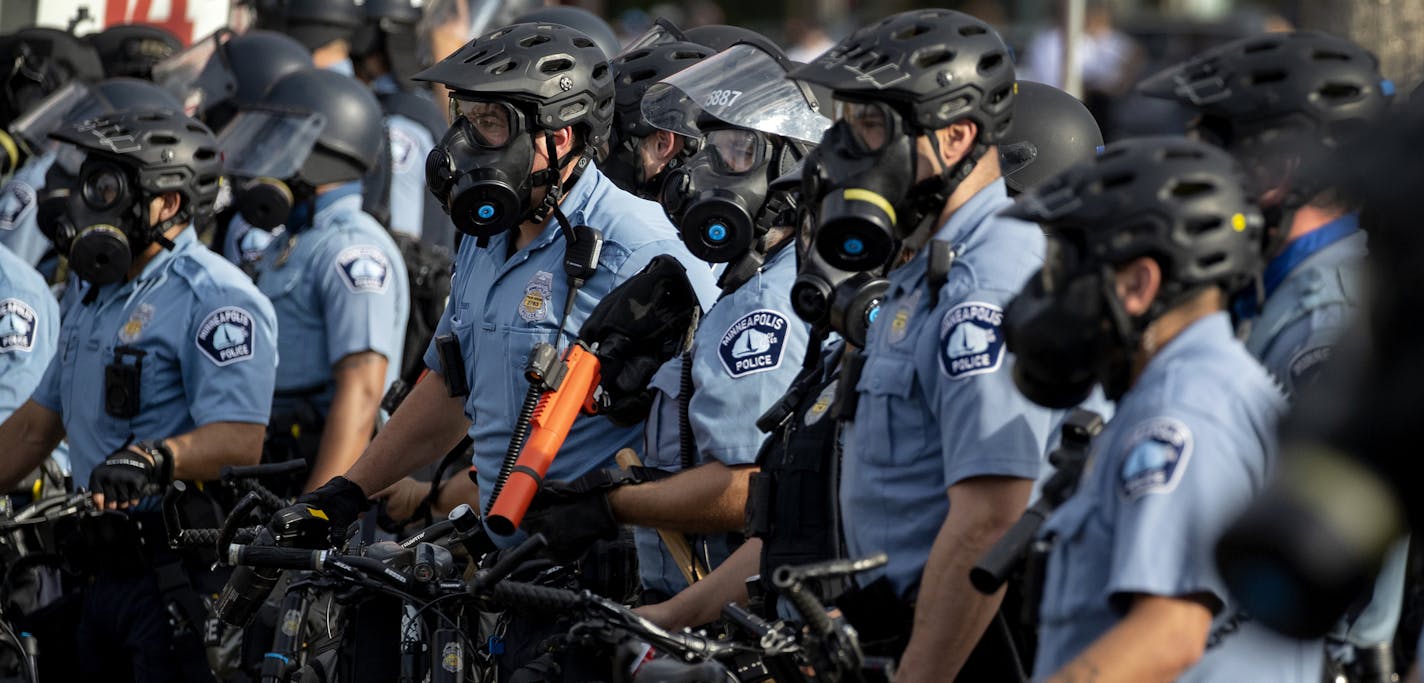 Minneapolis police officers gathered in May amid the protests over the killing of George Floyd while in police custody.