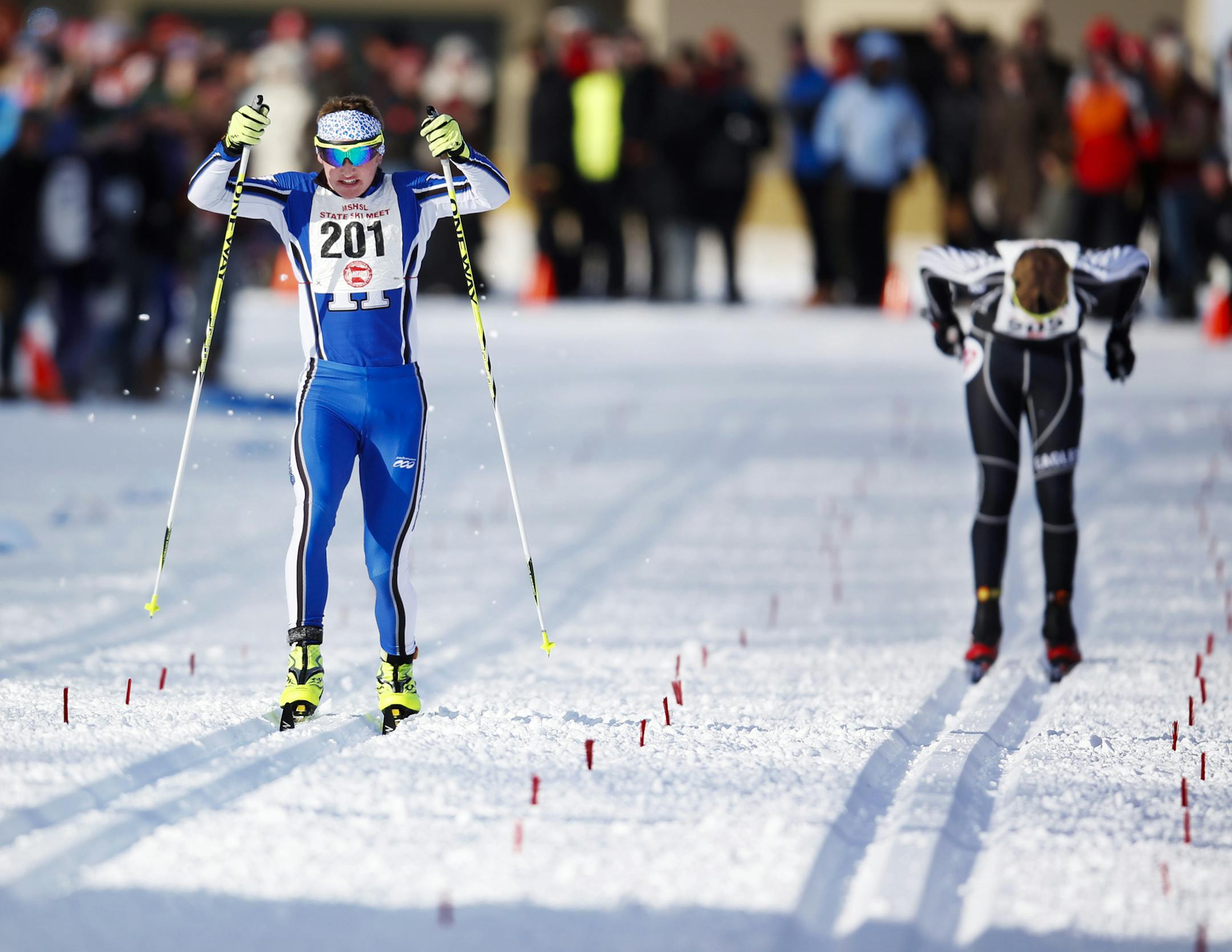 Jakob Ellingson of Hopkins High beat out Thomas Bye of Eden Prairie near the finish line, winning the classic en route to winning the boys pursuit at the Nordic State Ski Meet Thursday, Feb. 14, 2013, at Giants Ridge in Biwabik