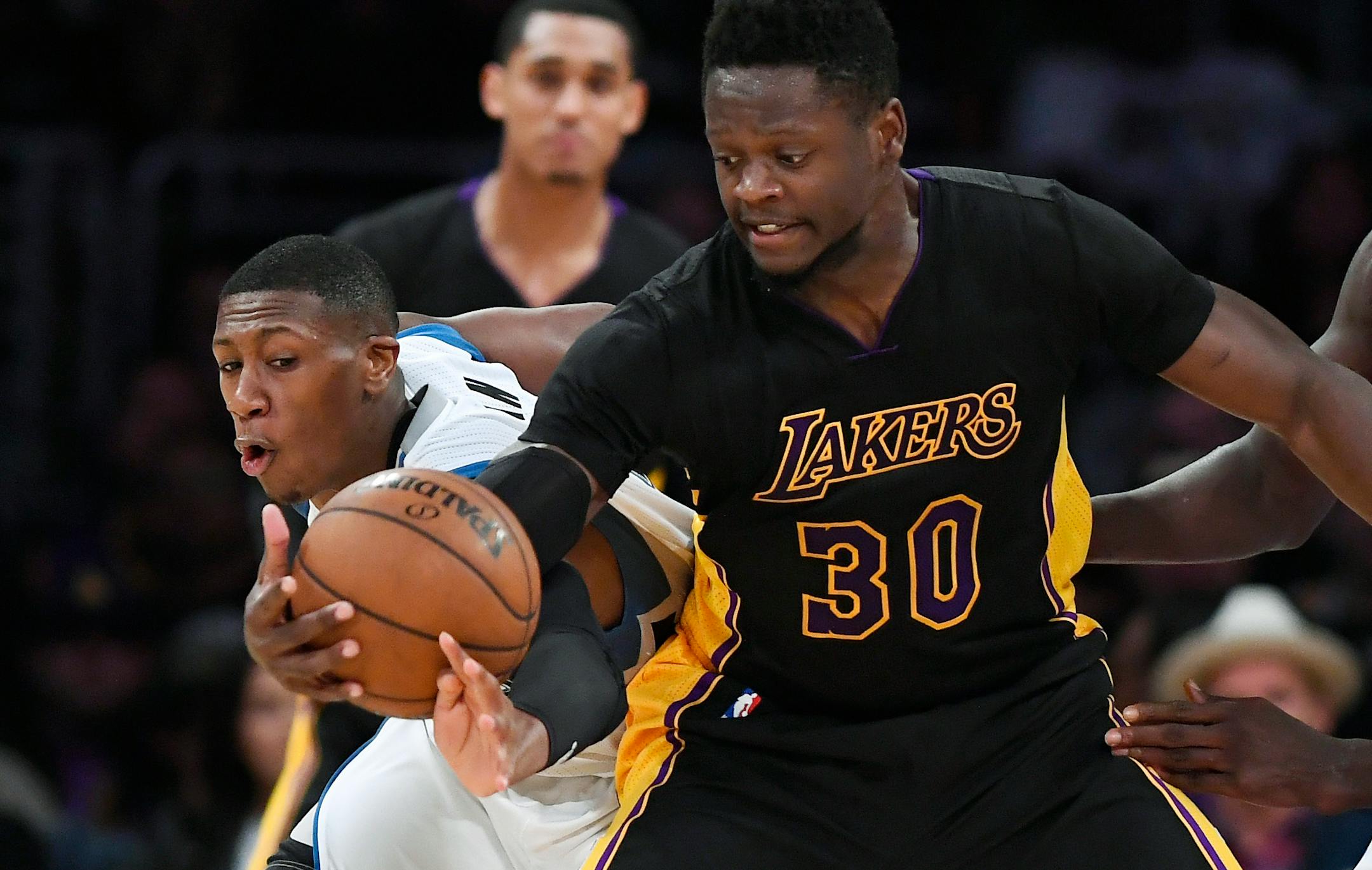 Wolves rookie Kris Dunn, left, has seen his minutes increase of late, often playing in a three-guard set.