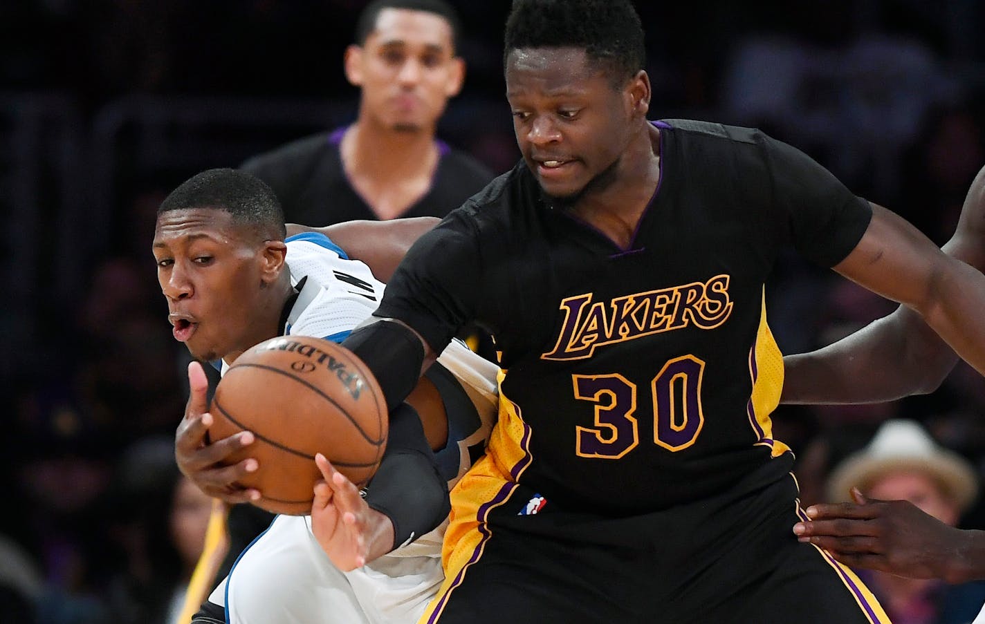 Wolves rookie Kris Dunn, left, has seen his minutes increase of late, often playing in a three-guard set.