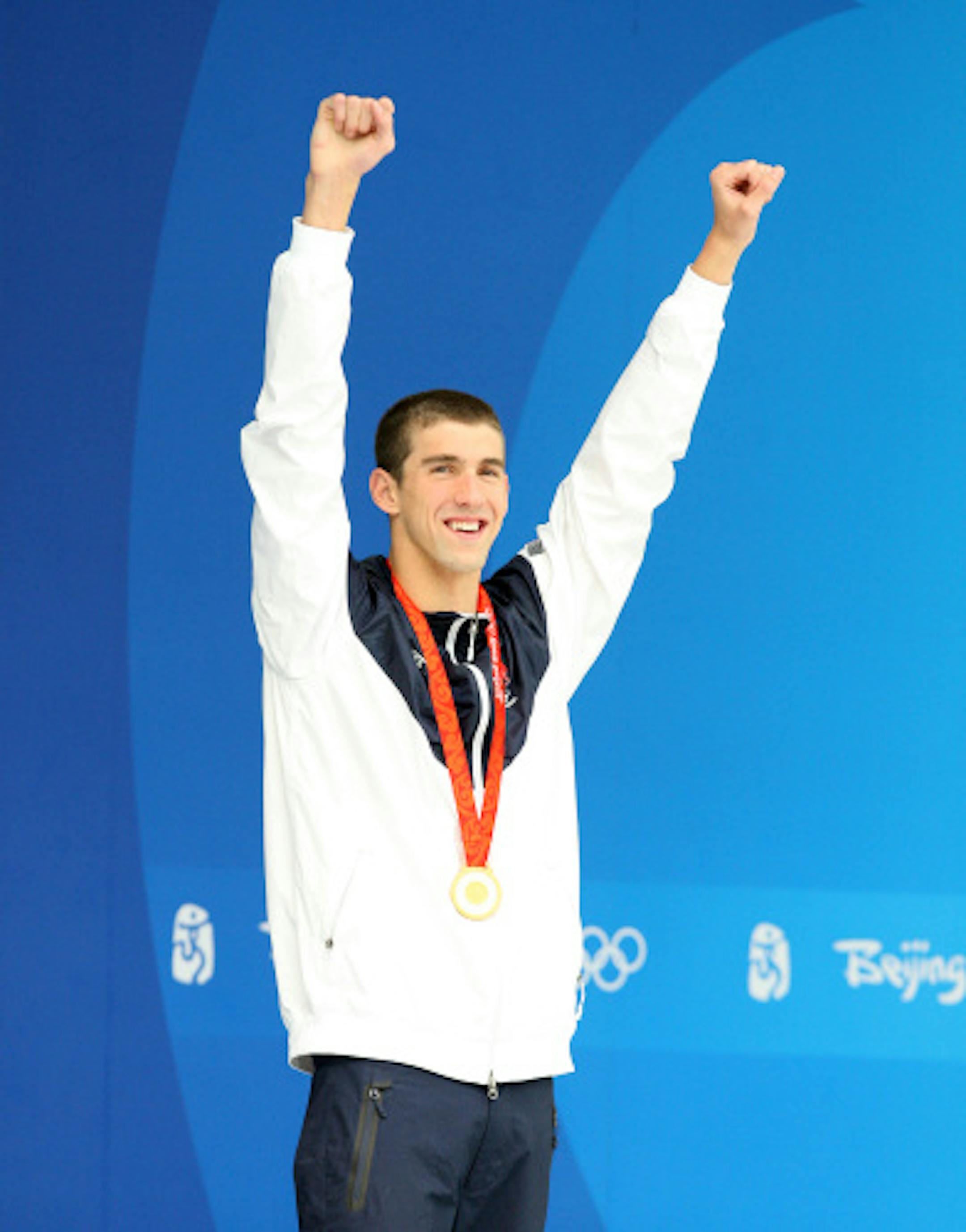 USA's Michael Phelps after receiving his gold medal in the Mens 100m butterfly in a world record time. The win gave Phelps 7 gold medals at the 2008 Olympics.