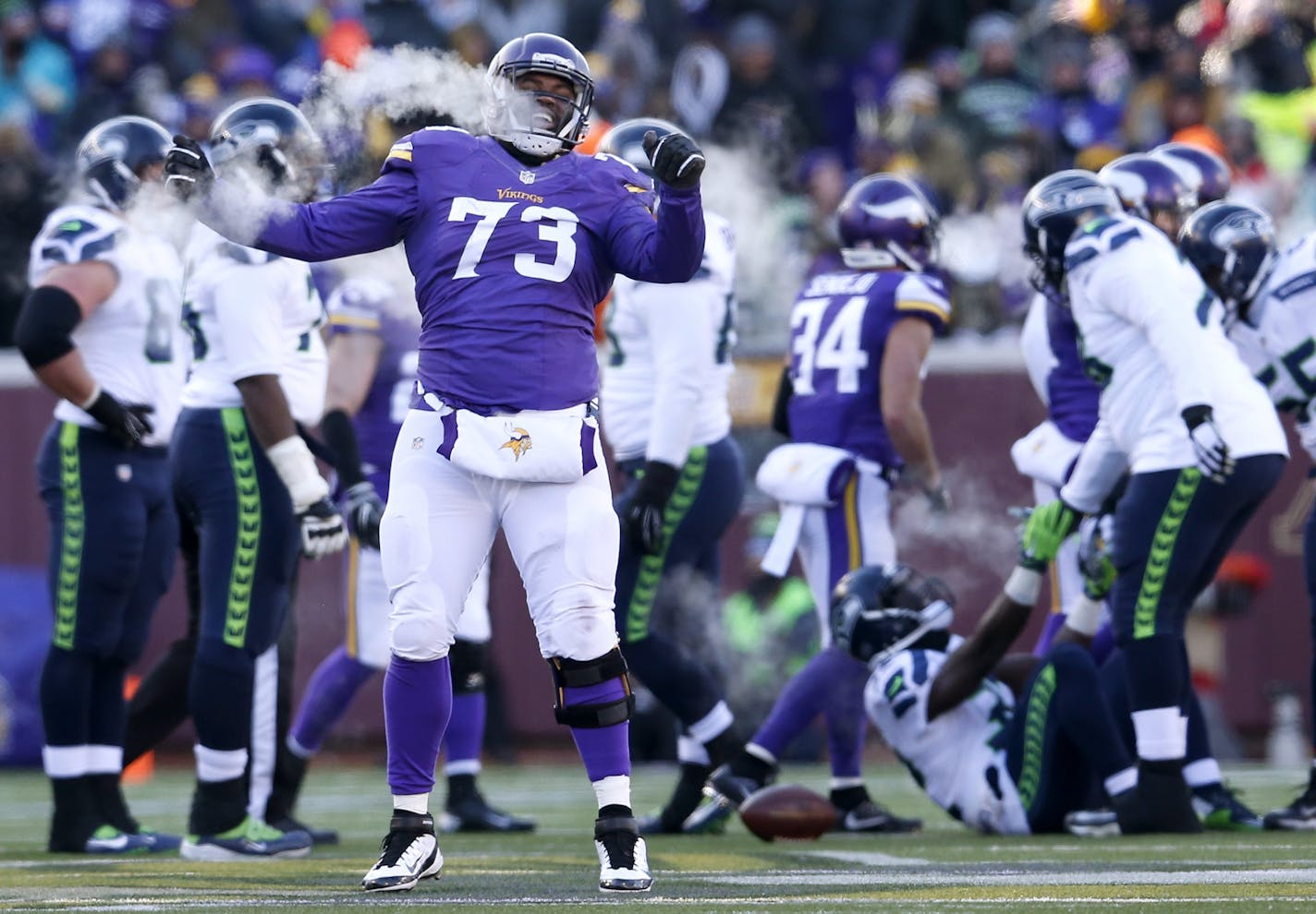 Sharrif Floyd (73) celebrated after tackling Christine Michael (32).