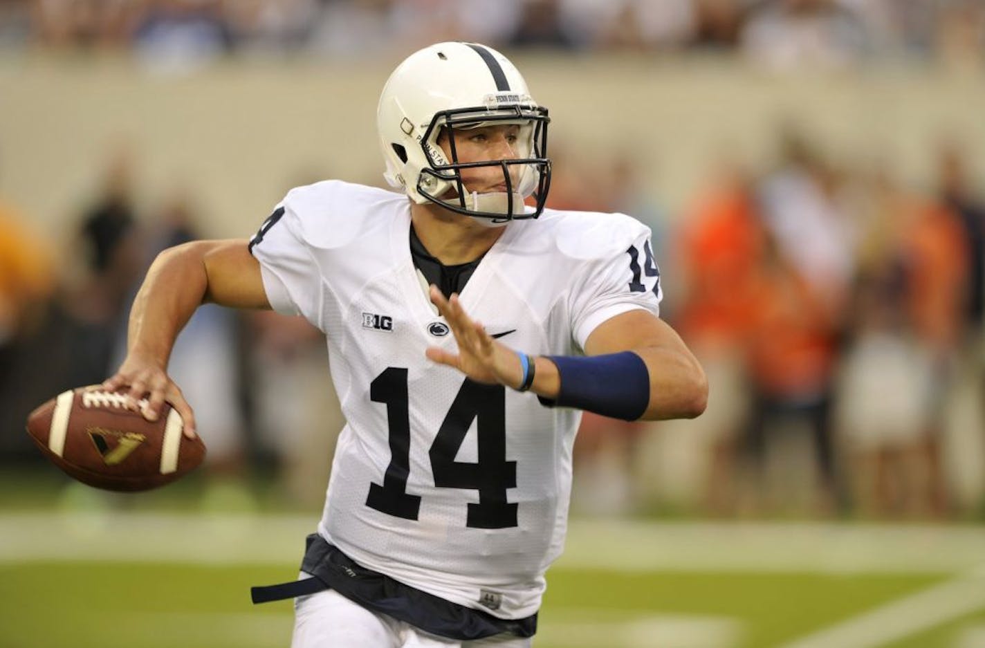 Penn State quarterback Christian Hackenberg (14) rolls out of the pocket in the second half against Syracuse at MetLife Stadium in East Rutherford, New Jersey, on Saturday, August 31, 2013. Penn State defeated Syracuse, 23-17.